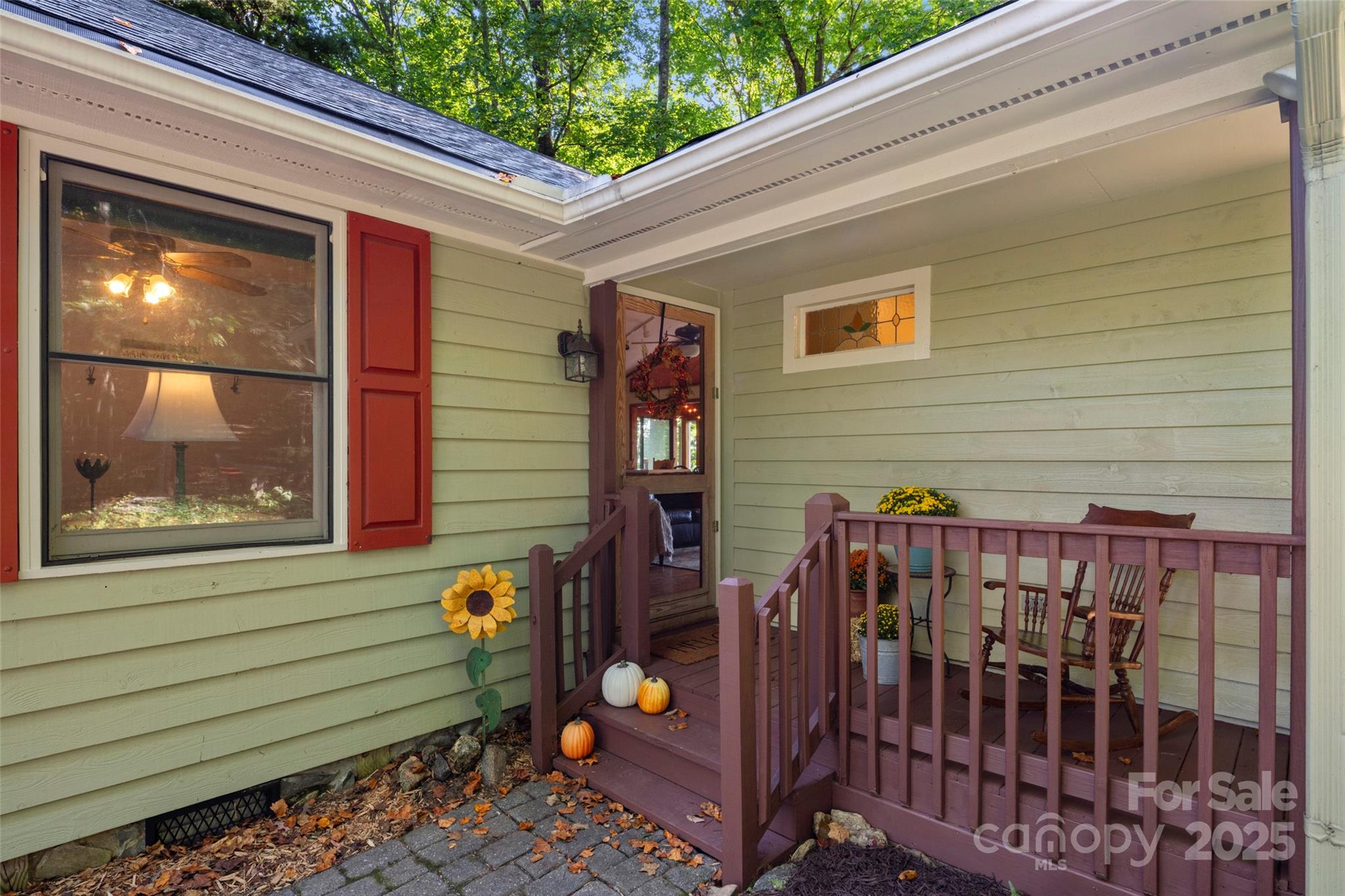 31 Piney Rdg Lane, Unit 27 Saluda, NC 28773 - Photo 5 of 36 a view of a porch with a bench