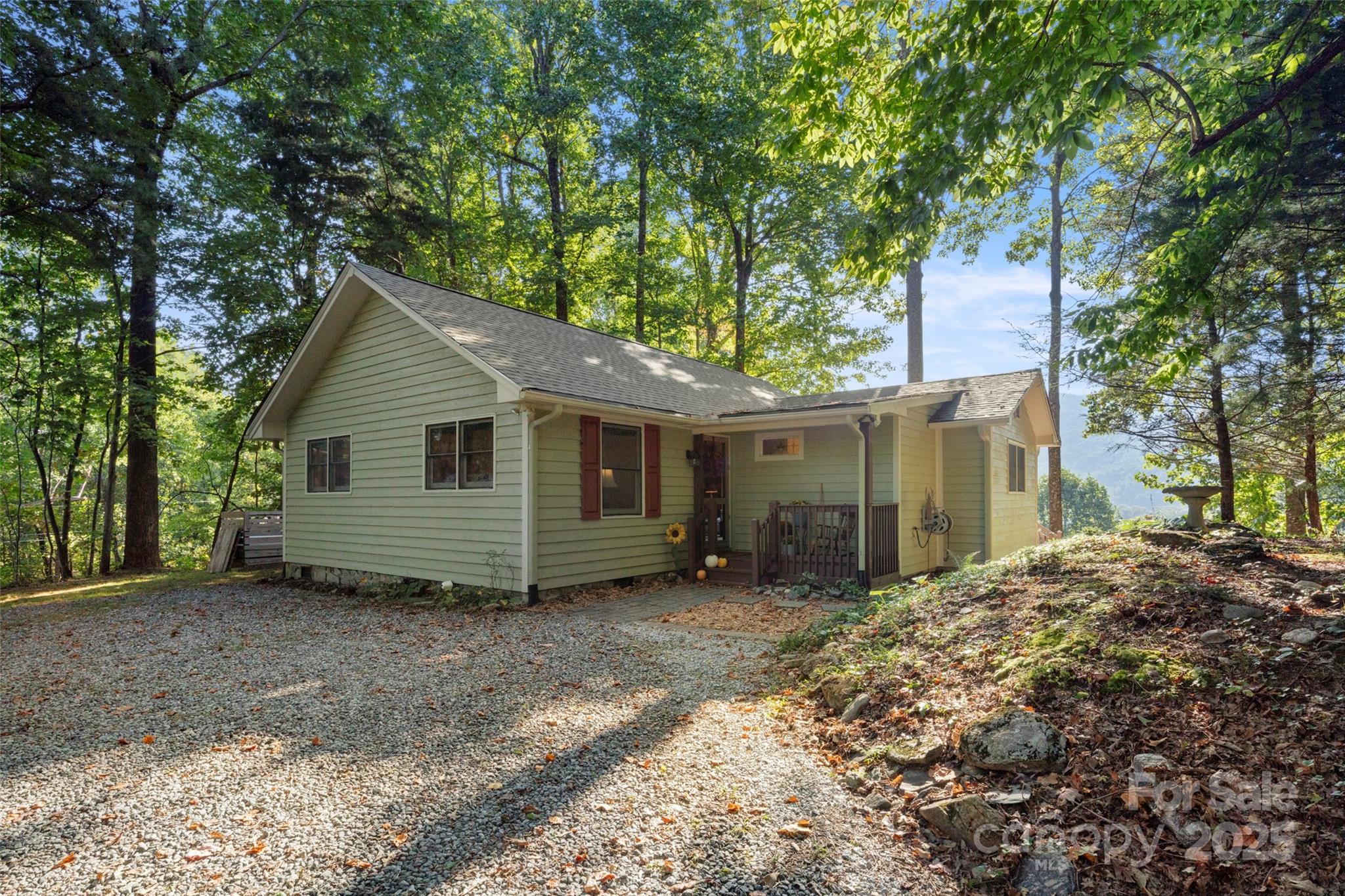 31 Piney Rdg Lane, Unit 27 Saluda, NC 28773 - Photo 7 of 36 a view of a house with a yard and large trees