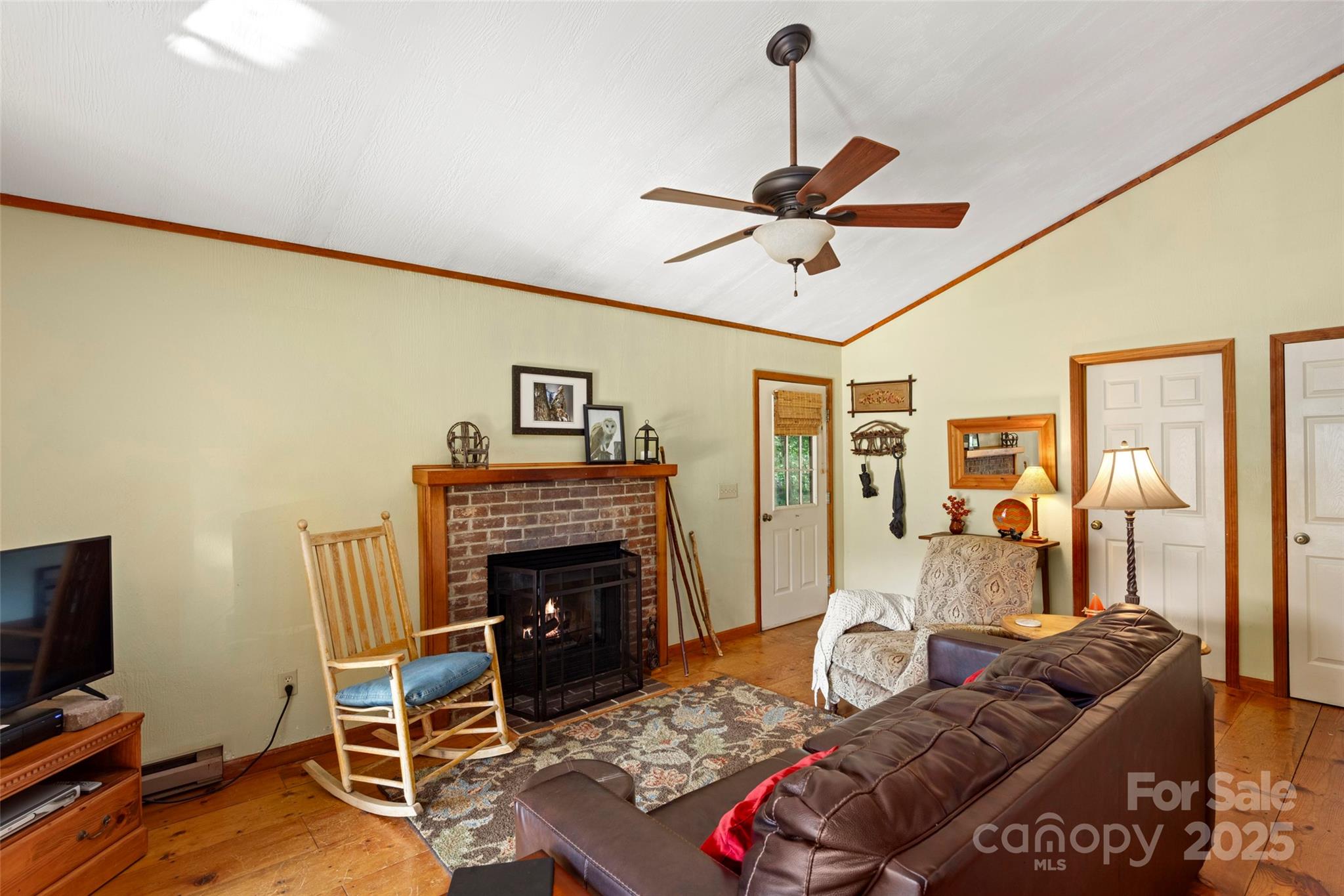 31 Piney Rdg Lane, Unit 27 Saluda, NC 28773 - Photo 8 of 36 a living room with furniture and a fireplace