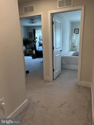 a bed room with a bed and a television