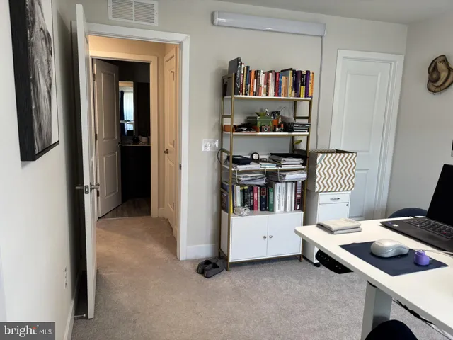 a bed room with a bed and a mirror