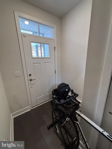 a view of entryway with wooden floor
