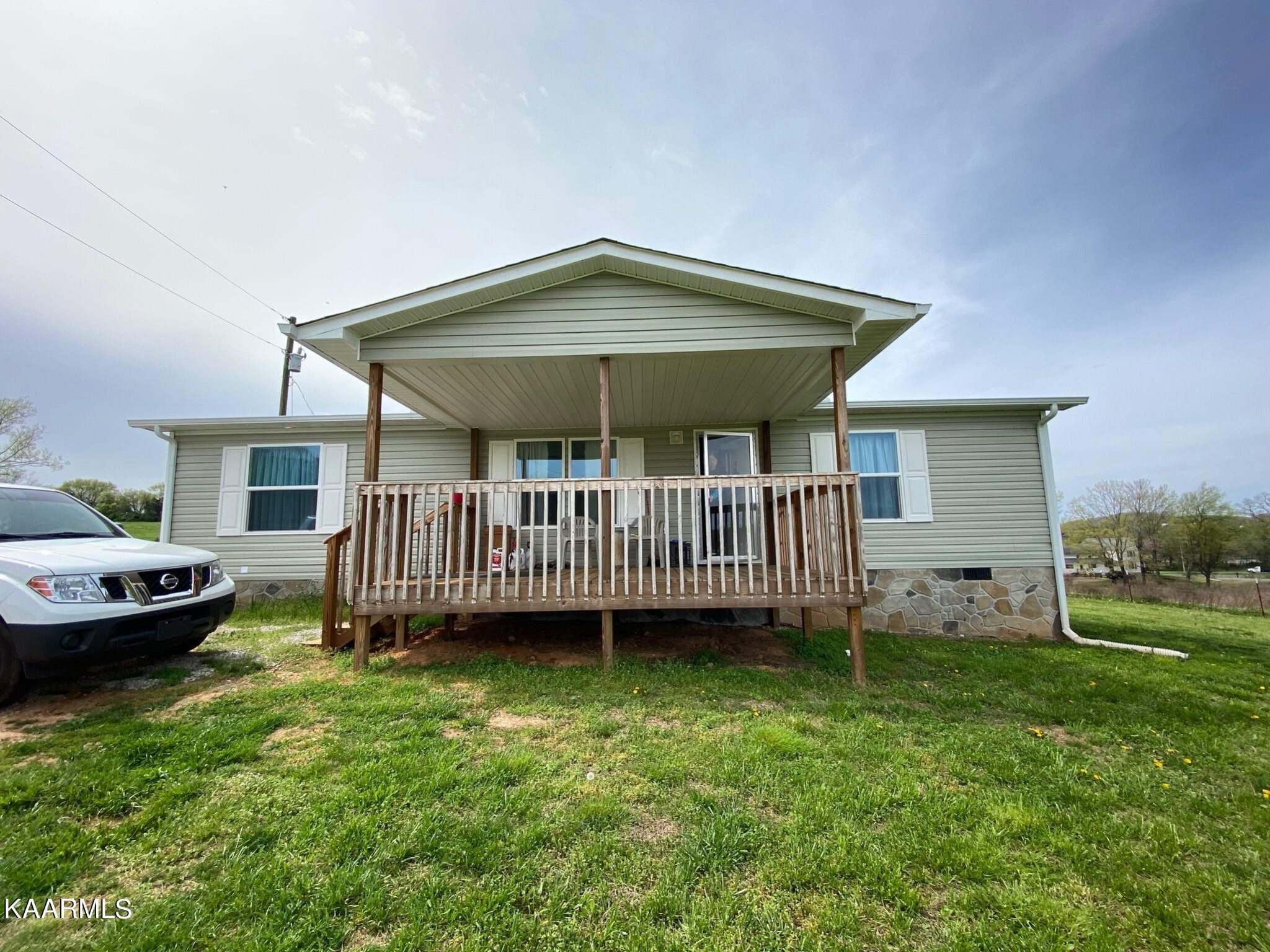 929 Reed Bull Road New Market, TN 37820 - Photo 3 of 11 a view of a house with a backyard and deck