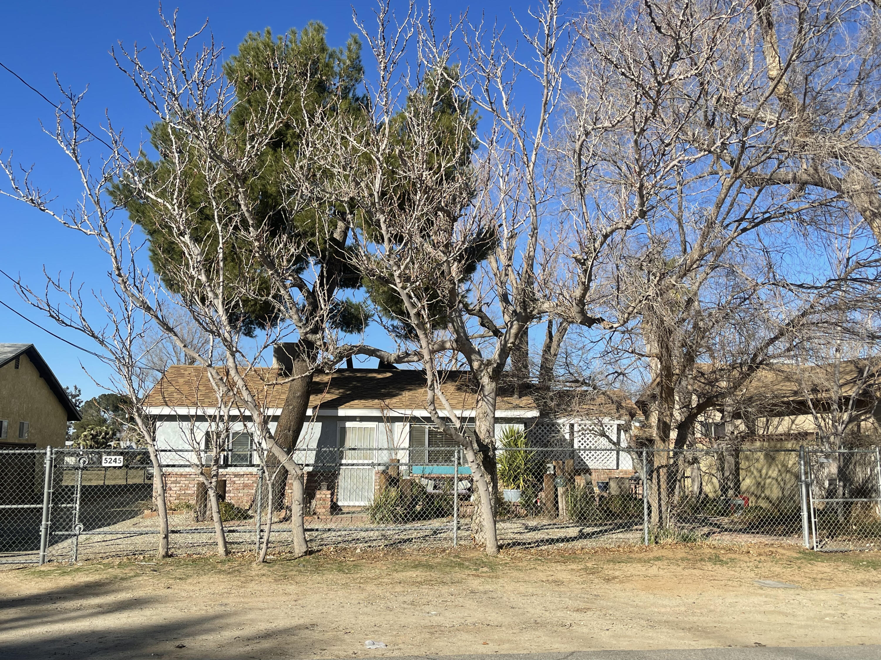 5245 West Ave L4 Lancaster, CA 93536 - Photo 1 of 35 a view of a building with a yard