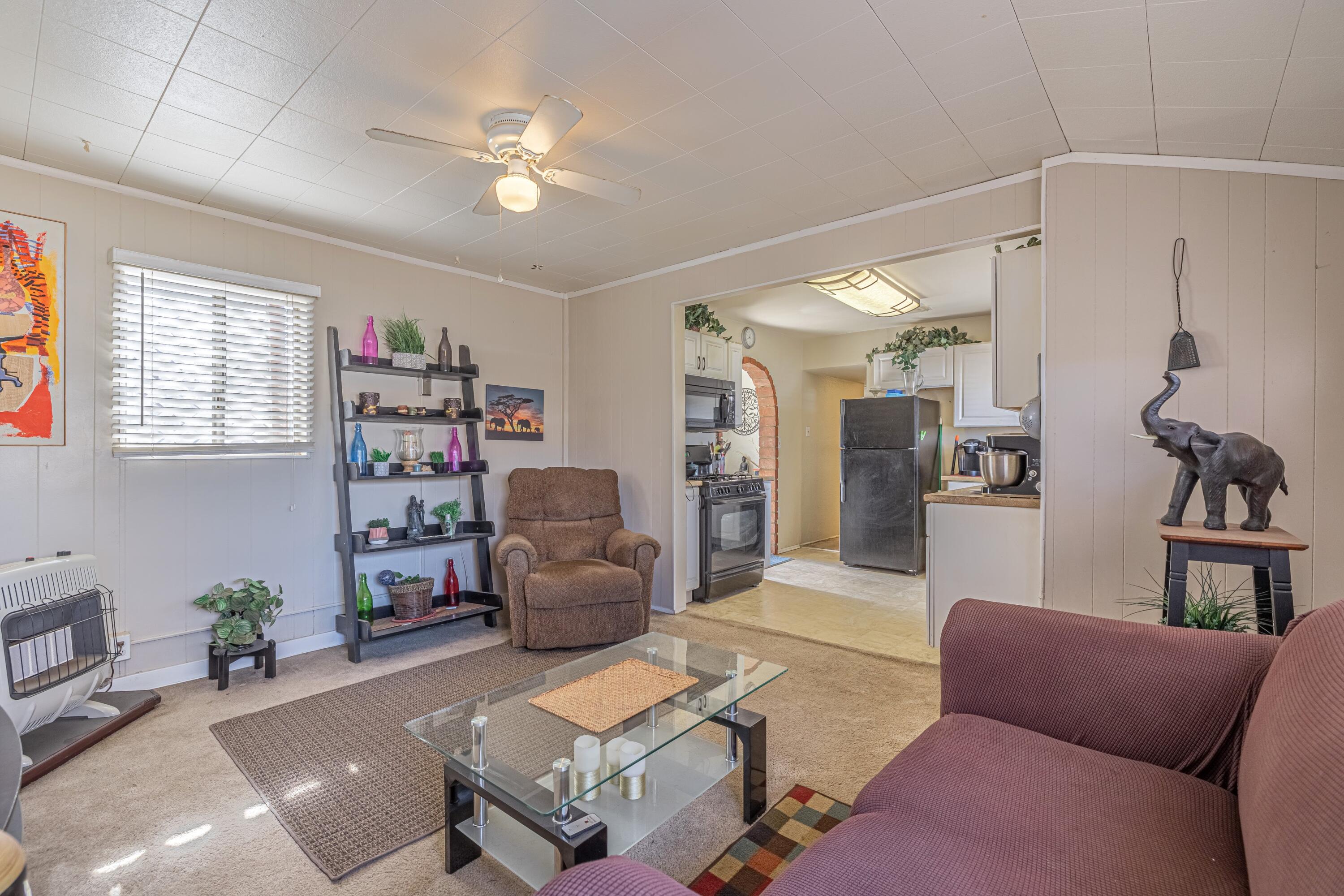 5245 West Ave L4 Lancaster, CA 93536 - Photo 12 of 35 a living room with furniture and a chandelier