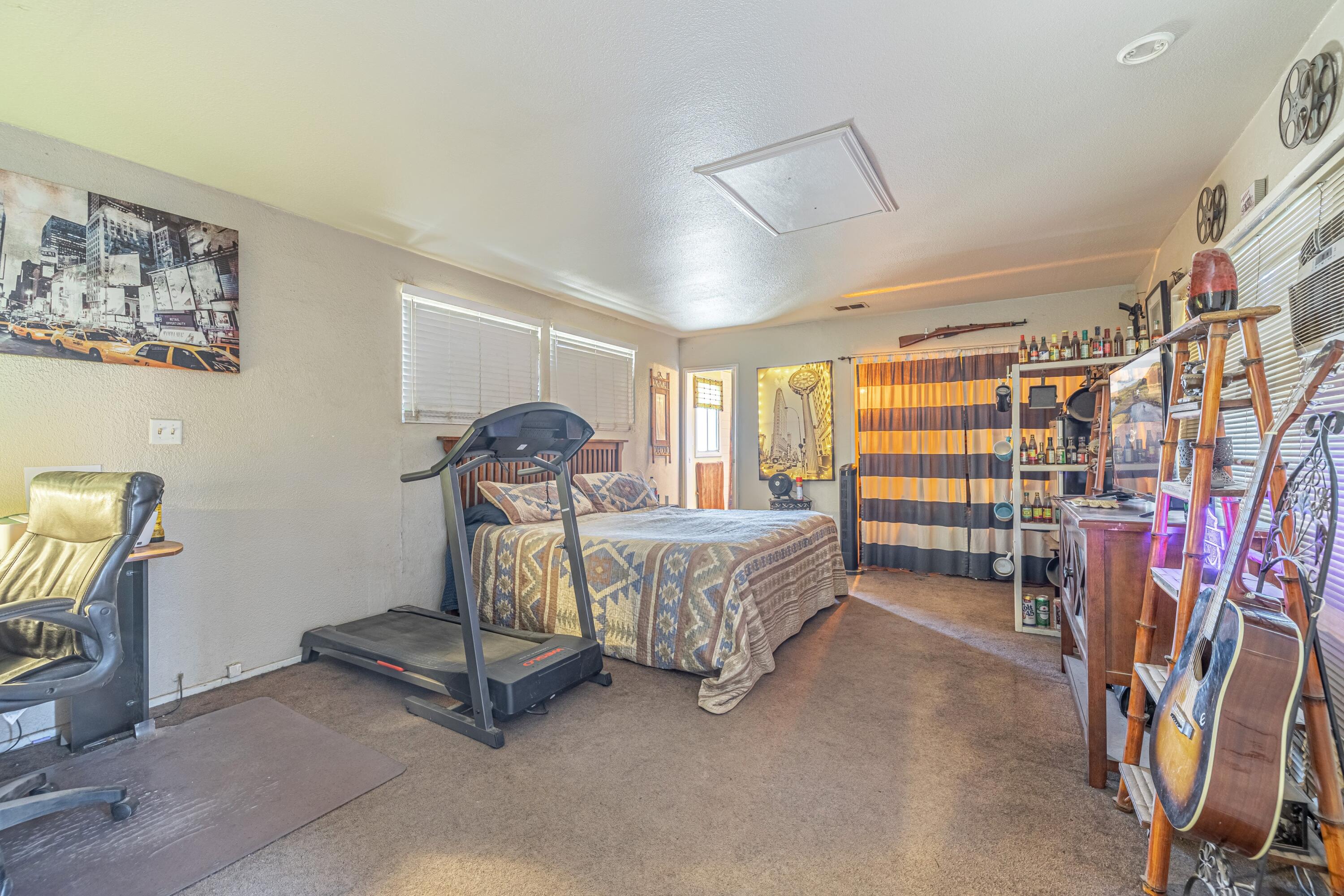 5245 West Ave L4 Lancaster, CA 93536 - Photo 20 of 35 a bedroom with furniture and a window