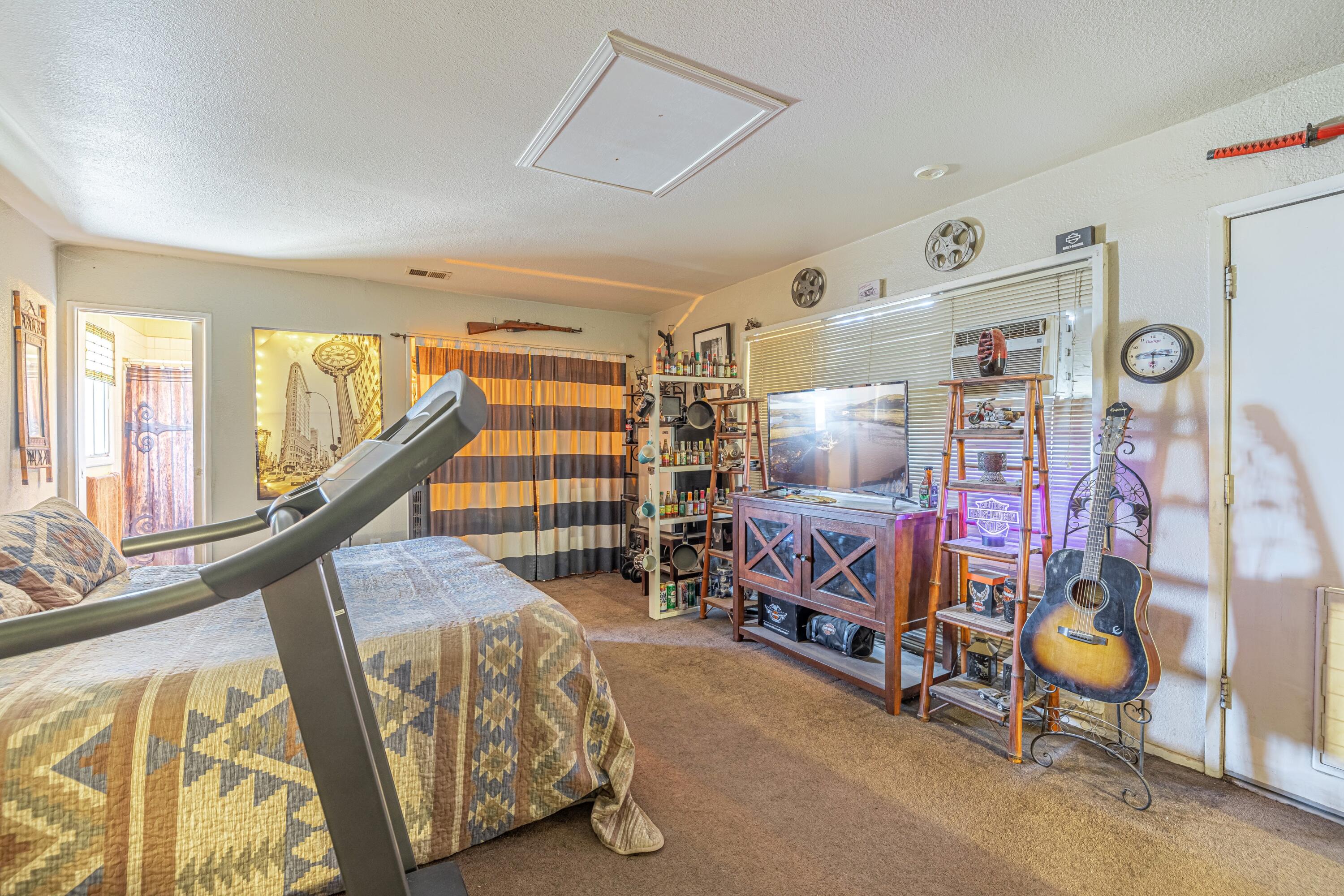 5245 West Ave L4 Lancaster, CA 93536 - Photo 21 of 35 a bedroom with furniture and a window