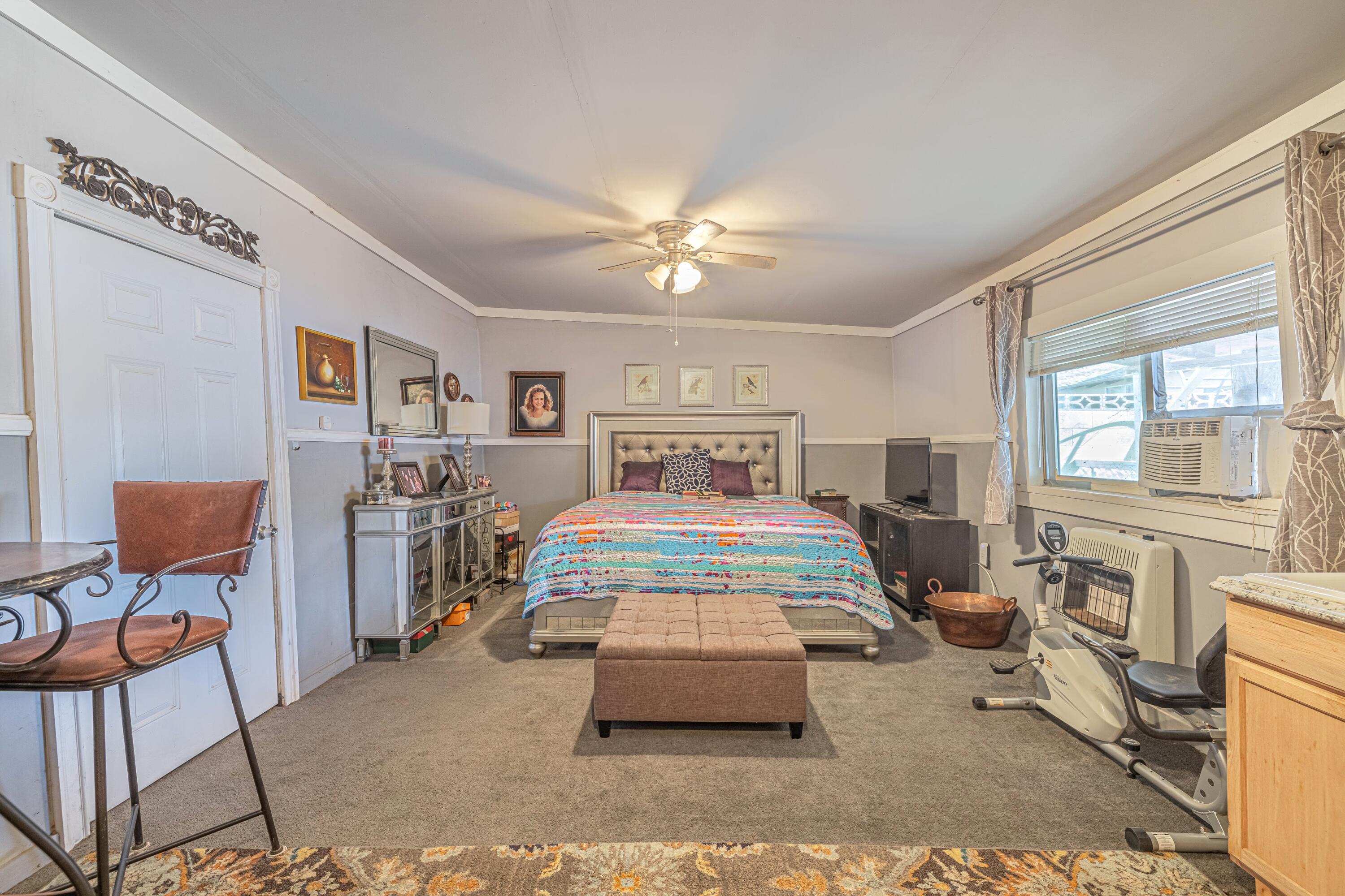 5245 West Ave L4 Lancaster, CA 93536 - Photo 29 of 35 a bedroom with furniture and window