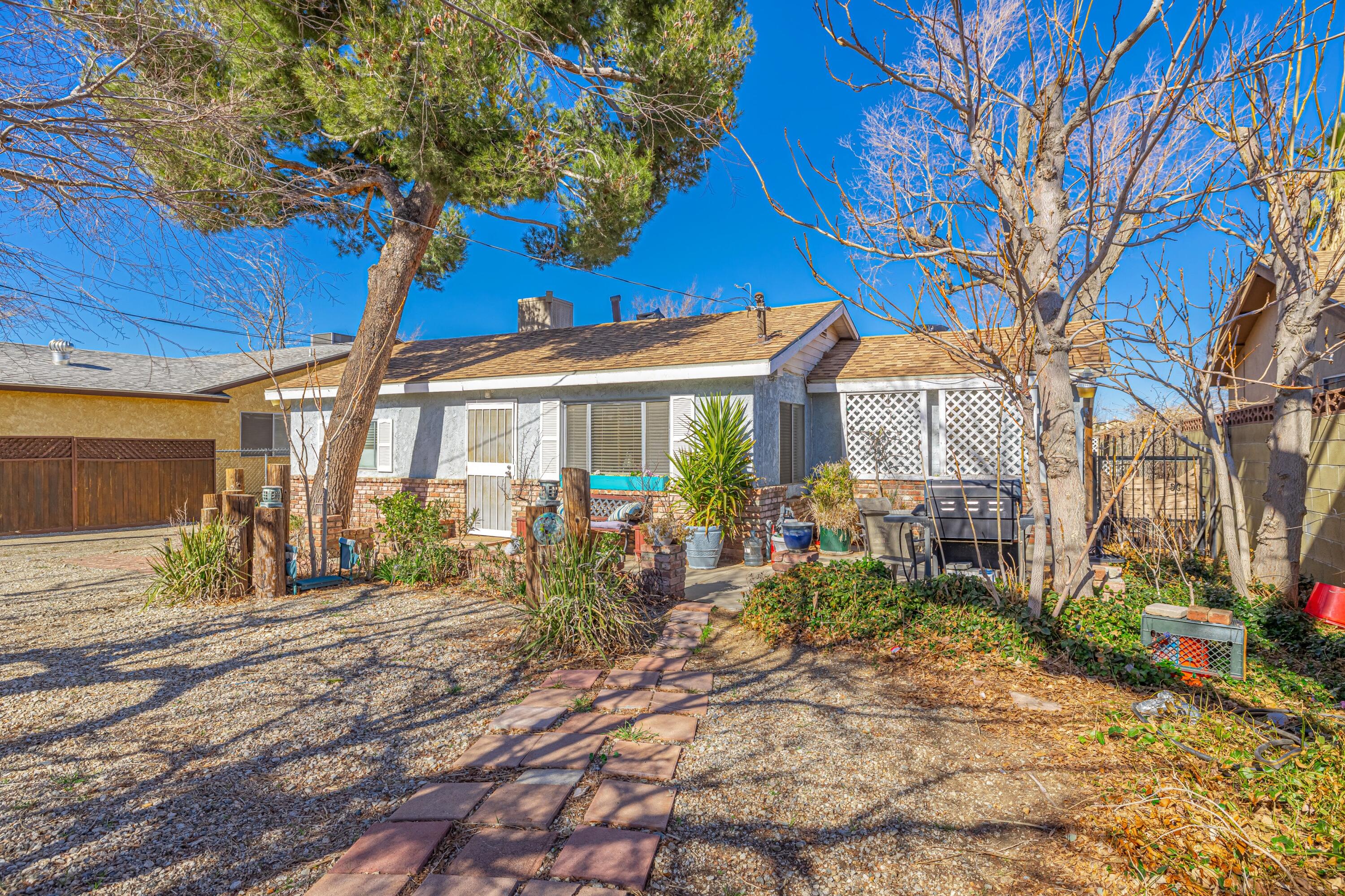5245 West Ave L4 Lancaster, CA 93536 - Photo 4 of 35 a view of a house with a patio