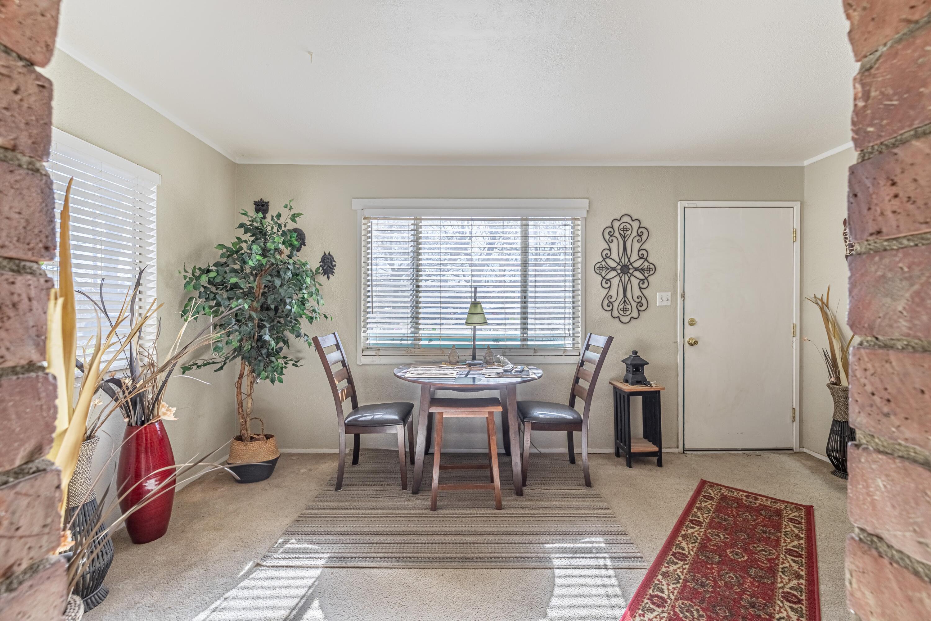 5245 West Ave L4 Lancaster, CA 93536 - Photo 7 of 35 a dining room with furniture and wooden floor