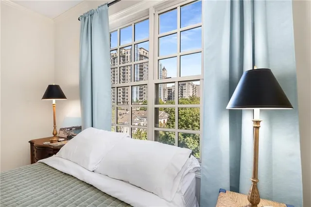 a bedroom with a bed and a lamp on table