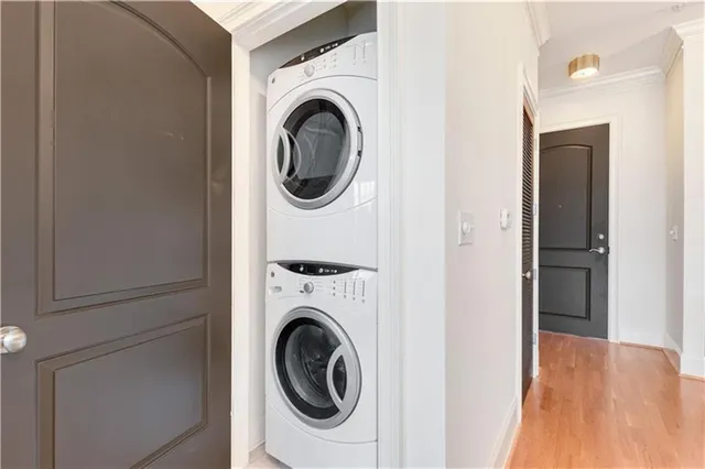 a view of a hallway with washer and dryer