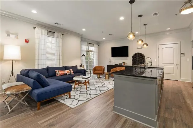 a living room with furniture and a flat screen tv
