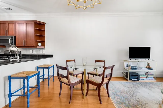 a view of a livingroom with furniture and a flat screen tv