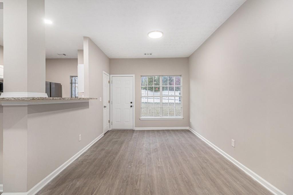 2563 Walden Lake Drive Decatur, GA 30035 - Photo 12 of 27 a view of a kitchen with wooden floor and a kitchen