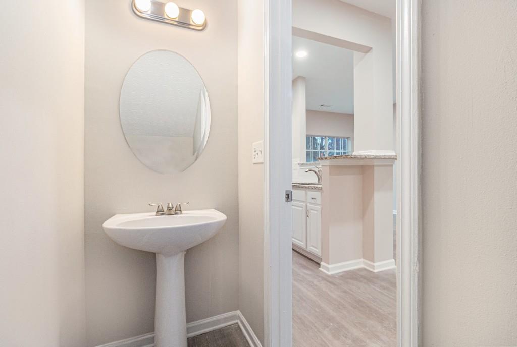 2563 Walden Lake Drive Decatur, GA 30035 - Photo 16 of 27 a bathroom with a sink a mirror and shower