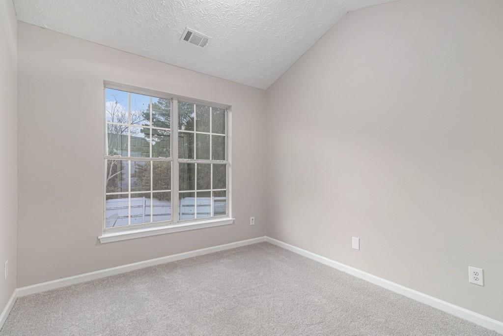 2563 Walden Lake Drive Decatur, GA 30035 - Photo 19 of 27 an empty room with a window
