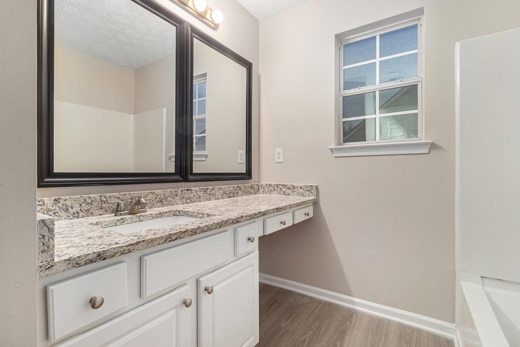 2563 Walden Lake Drive Decatur, GA 30035 - Photo 20 of 27 a bathroom with a sink and a mirror