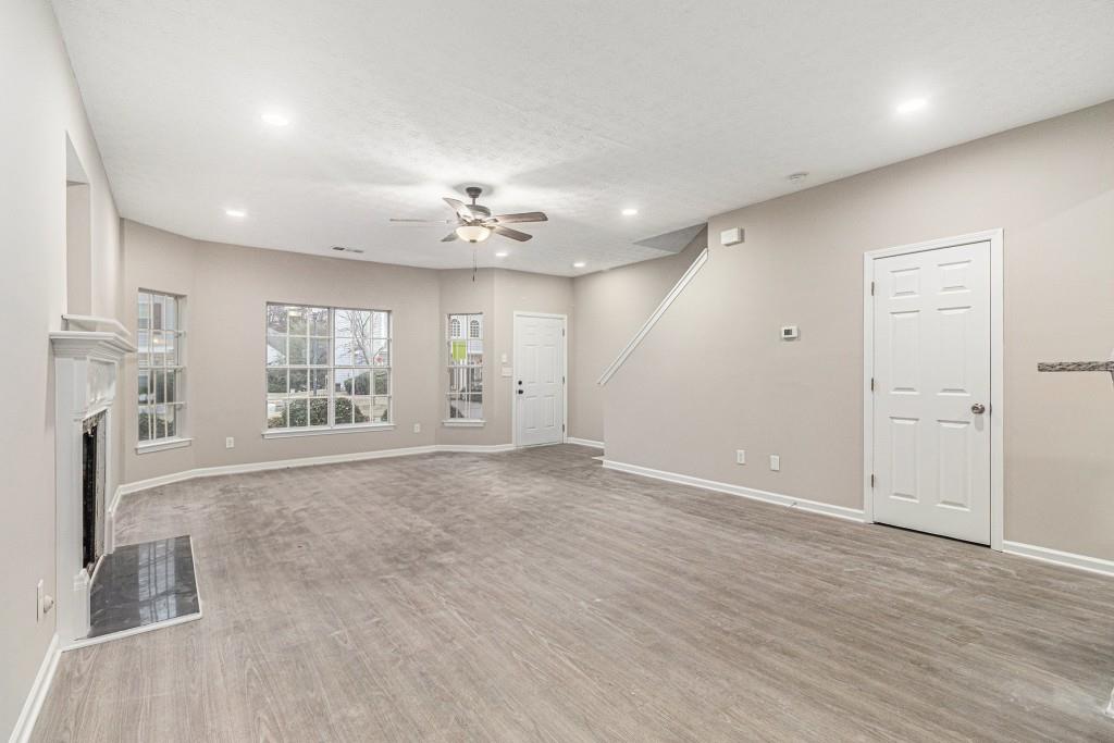 2563 Walden Lake Drive Decatur, GA 30035 - Photo 10 of 27 an empty room with wooden floor and windows