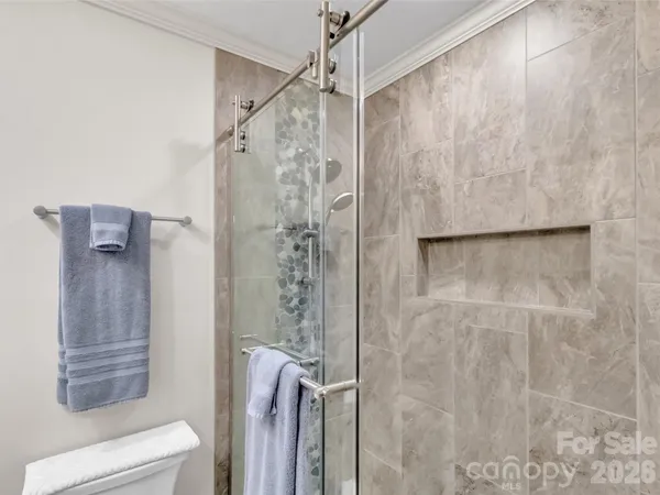 a bathroom with a shower and a toilet