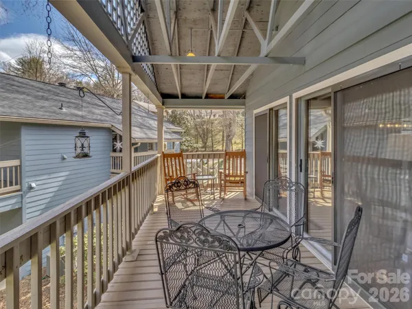 a view of balcony with furniture