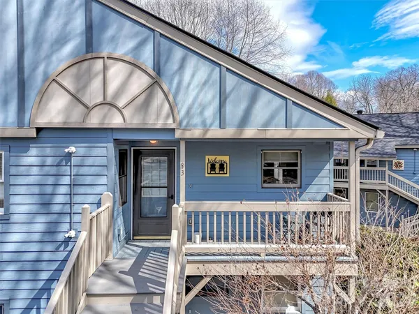 a front view of a house with wooden stairs