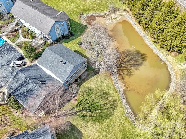 a view of swimming pool with a yard