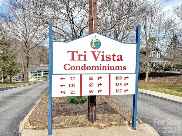 a sign on the side of a street