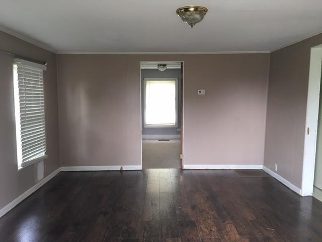 8314 Coppock Road Corryton, TN 37721 - Photo 15 of 29 an empty room with wooden floor and windows