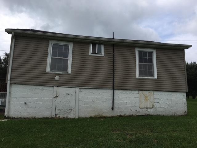 8314 Coppock Road Corryton, TN 37721 - Photo 16 of 29 a front view of a house with a garden