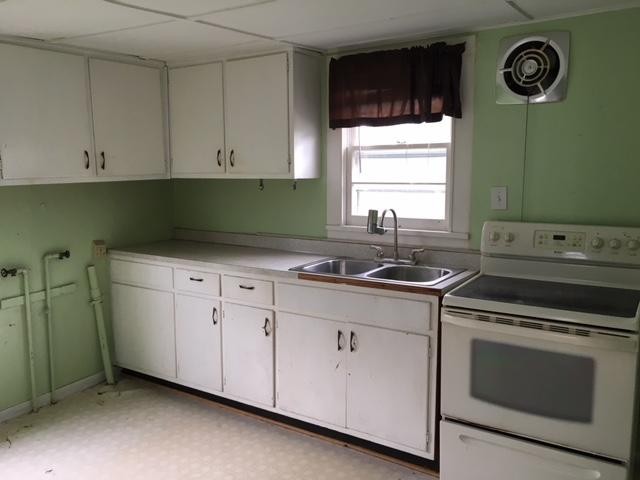 8314 Coppock Road Corryton, TN 37721 - Photo 20 of 29 a kitchen with a sink cabinets and a stove top oven