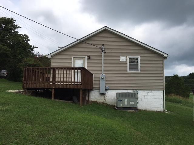 8314 Coppock Road Corryton, TN 37721 - Photo 7 of 29 a view of a house with a yard and deck