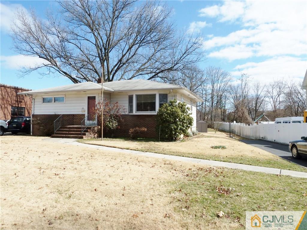 221 Crowells Road Edison, NJ 08817 - Photo 1 of 13 a view of a house with snow on the road