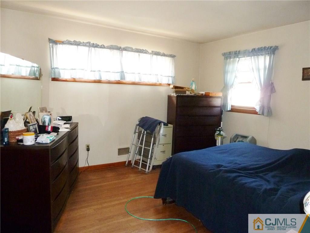 221 Crowells Road Edison, NJ 08817 - Photo 11 of 13 a bed room with a bed and a desk