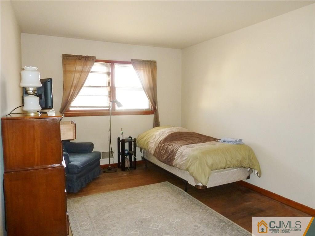 221 Crowells Road Edison, NJ 08817 - Photo 12 of 13 a bedroom with a bed and a window
