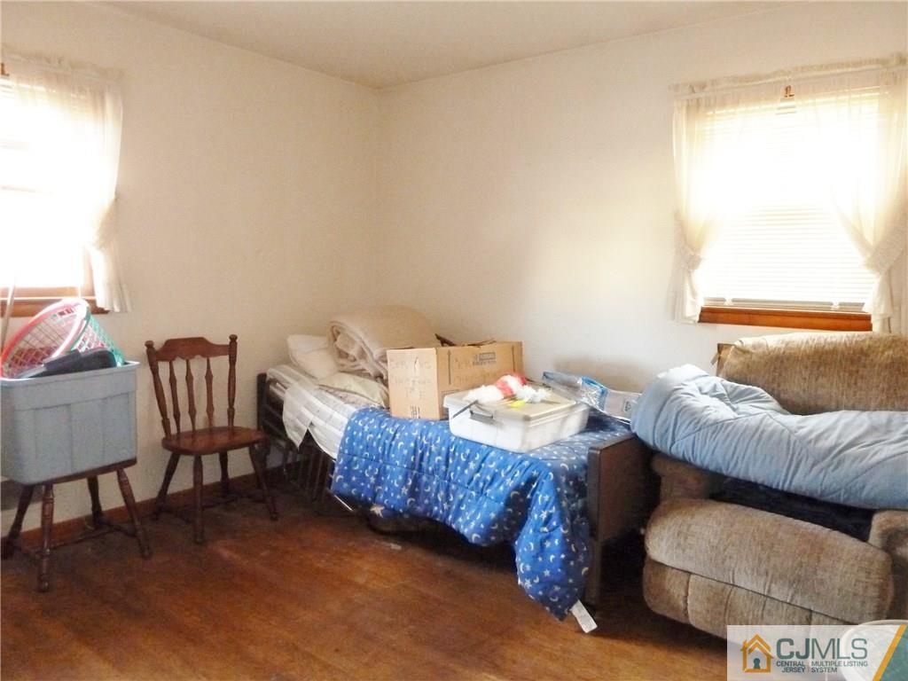 221 Crowells Road Edison, NJ 08817 - Photo 13 of 13 a living room with furniture and a window