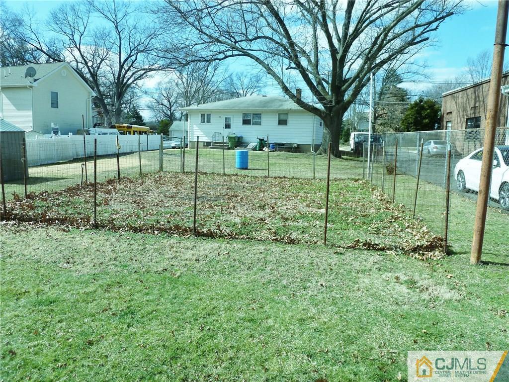 221 Crowells Road Edison, NJ 08817 - Photo 4 of 13 a view of a yard in front of a house