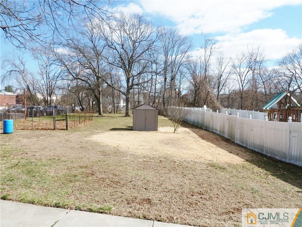 221 Crowells Road Edison, NJ 08817 - Photo 5 of 13 a view of outdoor space with trees