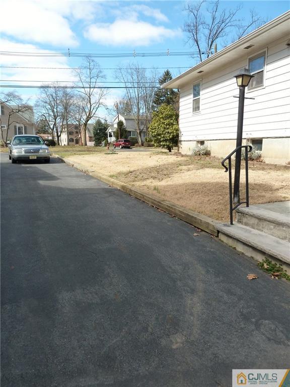 221 Crowells Road Edison, NJ 08817 - Photo 6 of 13 a view of a parking area