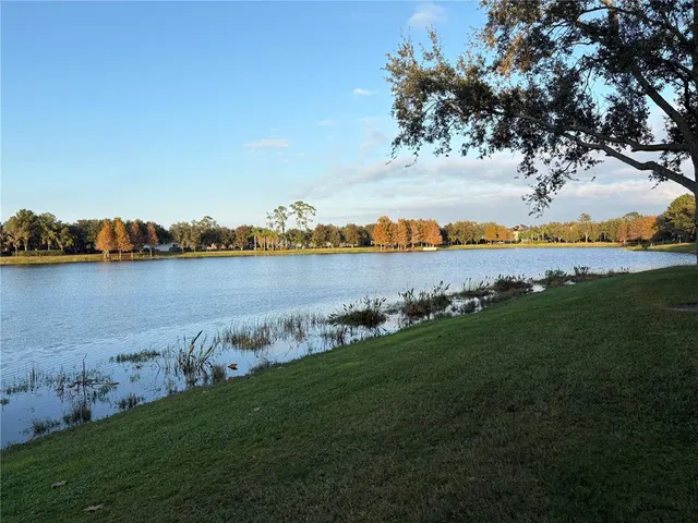 a view of a lake with houses in the background