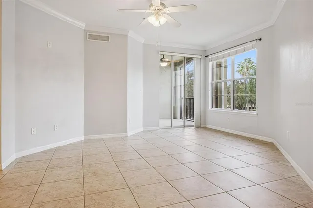 a view of an empty room with a window