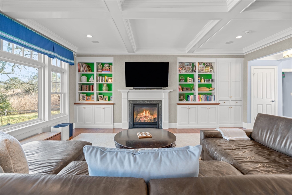 67 Uncle Alberts Drive Chatham, MA 02633 - Photo 11 of 41 a living room with furniture a flat screen tv and a fireplace
