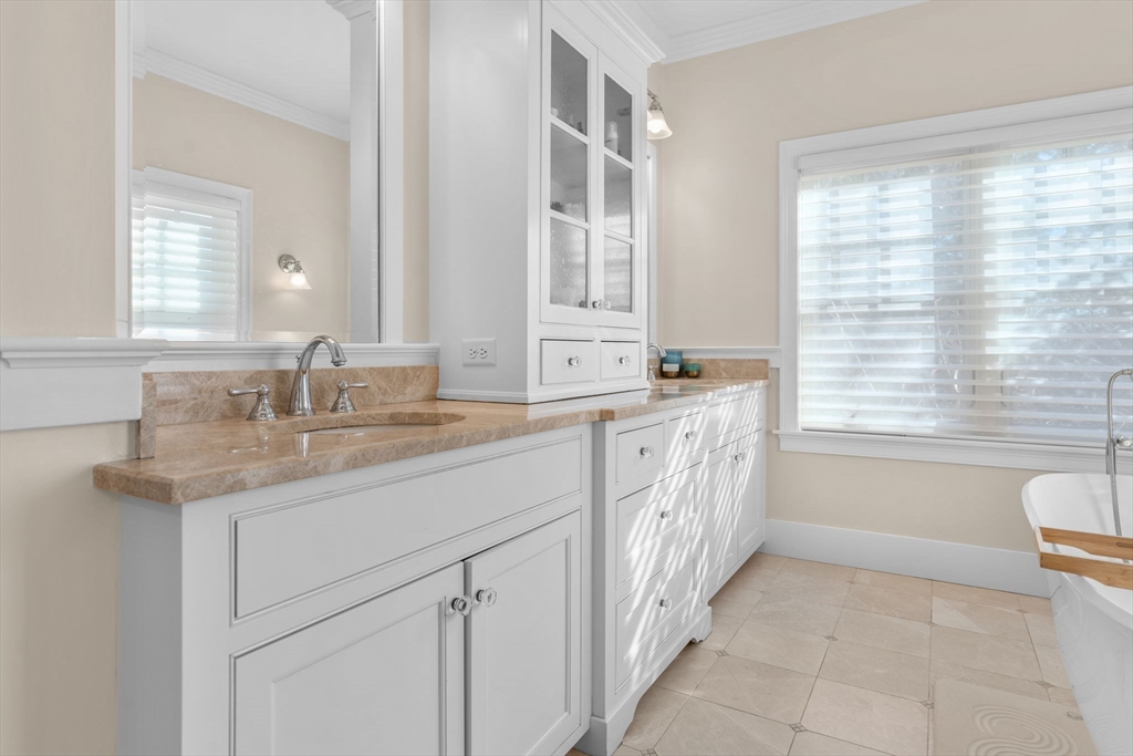 67 Uncle Alberts Drive Chatham, MA 02633 - Photo 23 of 41 a bathroom with a sink a vanity and a next to a window