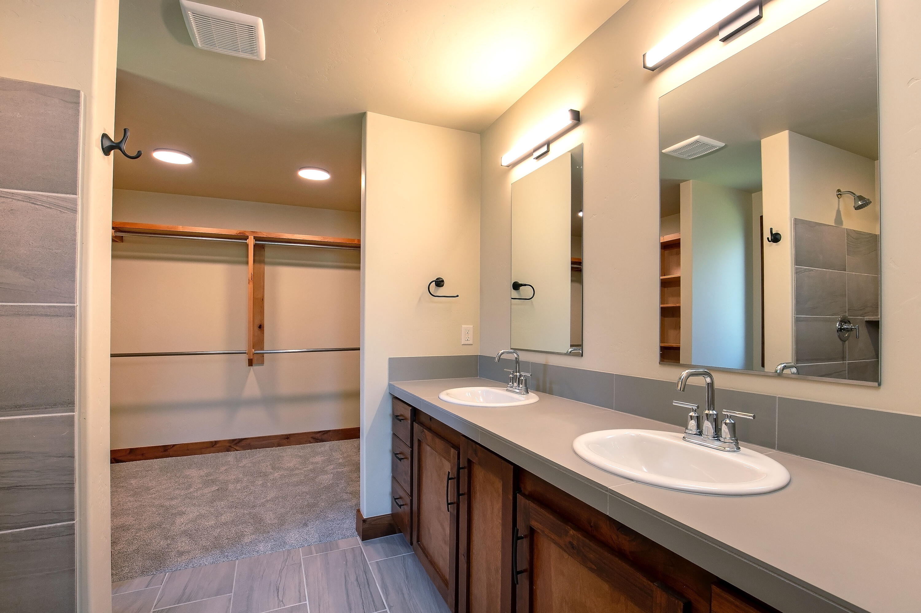 1472 Northeast Hudspeth Road Prineville, OR 97754 - Photo 15 of 26 a bathroom with a granite countertop sink and a mirror