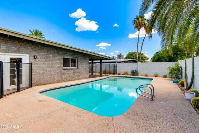 a view of a swimming pool with a lounge chairs