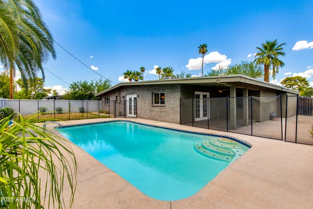 a view of a house with swimming pool
