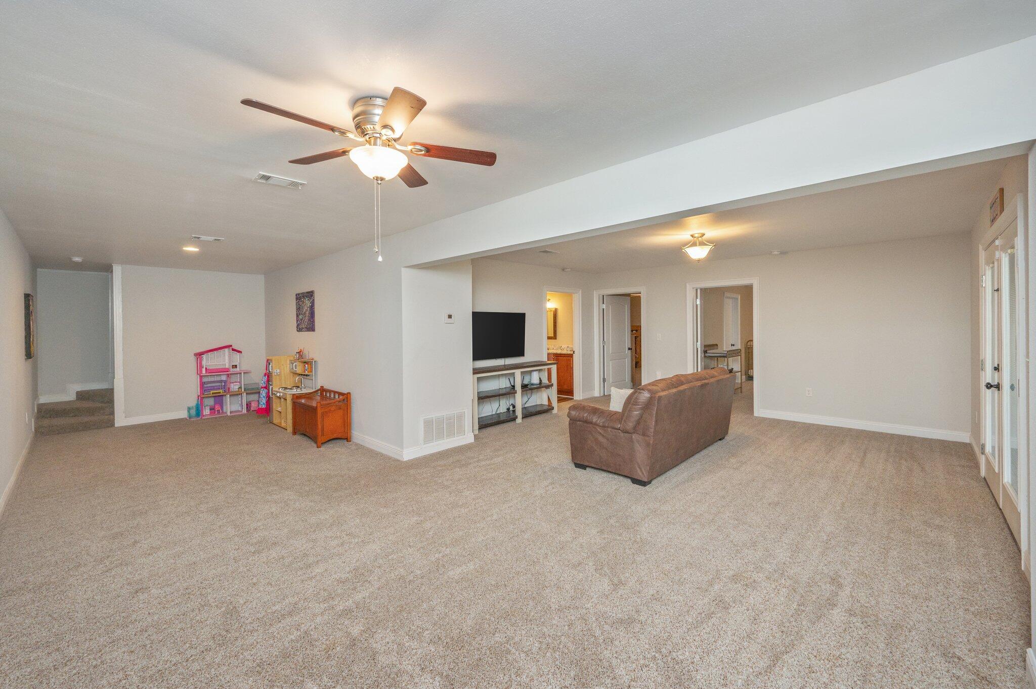 6265 Holloway Road Baker, FL 32531 - Photo 54 of 103 a living room with furniture and a chandelier