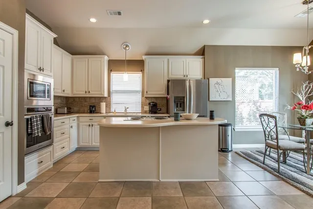 a living room with furniture fireplace and flat screen tv