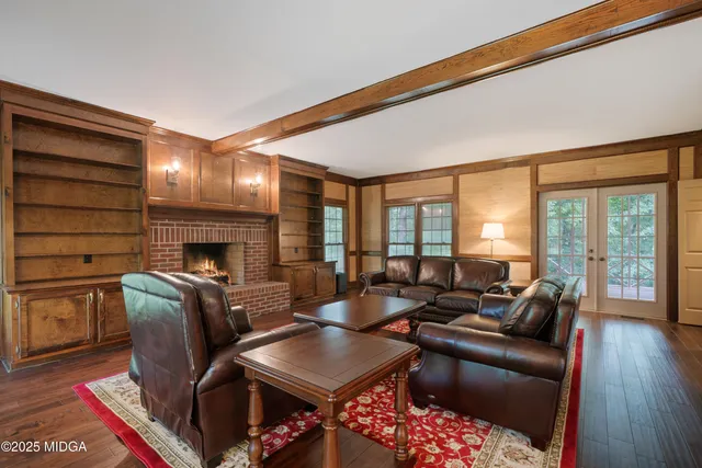 a view of a balcony with floor to ceiling windows with wooden floor