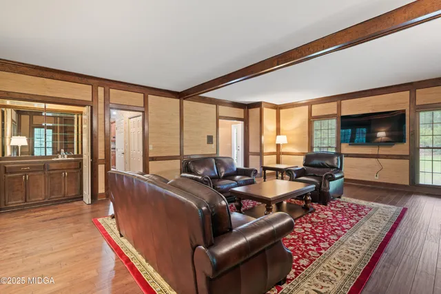 a bedroom with a bed and a ceiling fan